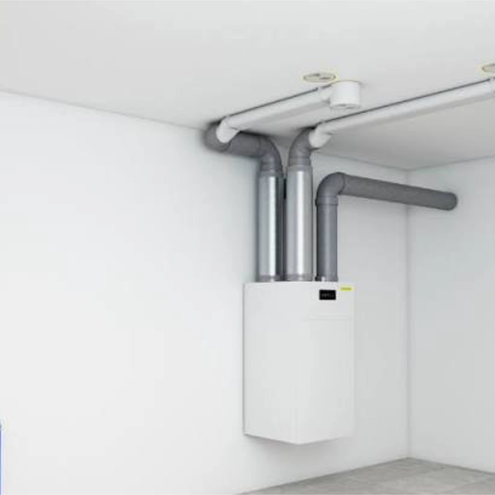 Wall-mounted MVHR unit with ventilation ducting installed in a clean indoor plant room.