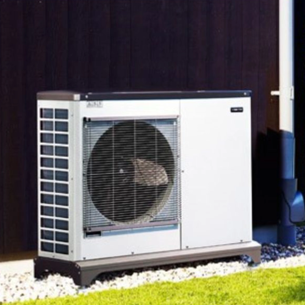 Mitsubishi air source heat pump installed outside a residential property.