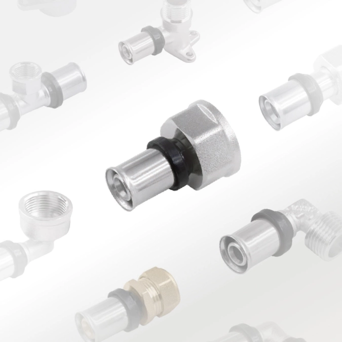 Metal press-fit union connector displayed among a selection of plumbing pipe fittings.