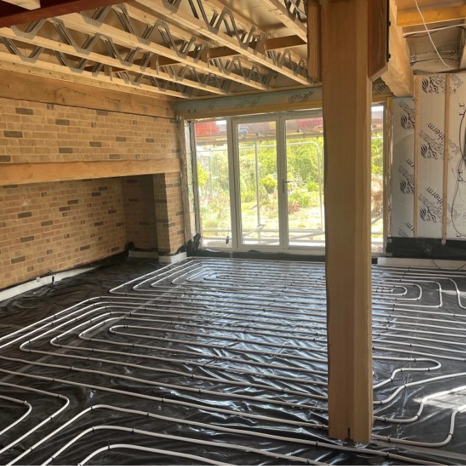 Underfloor heating pipes installed across the floor of a new-build property.